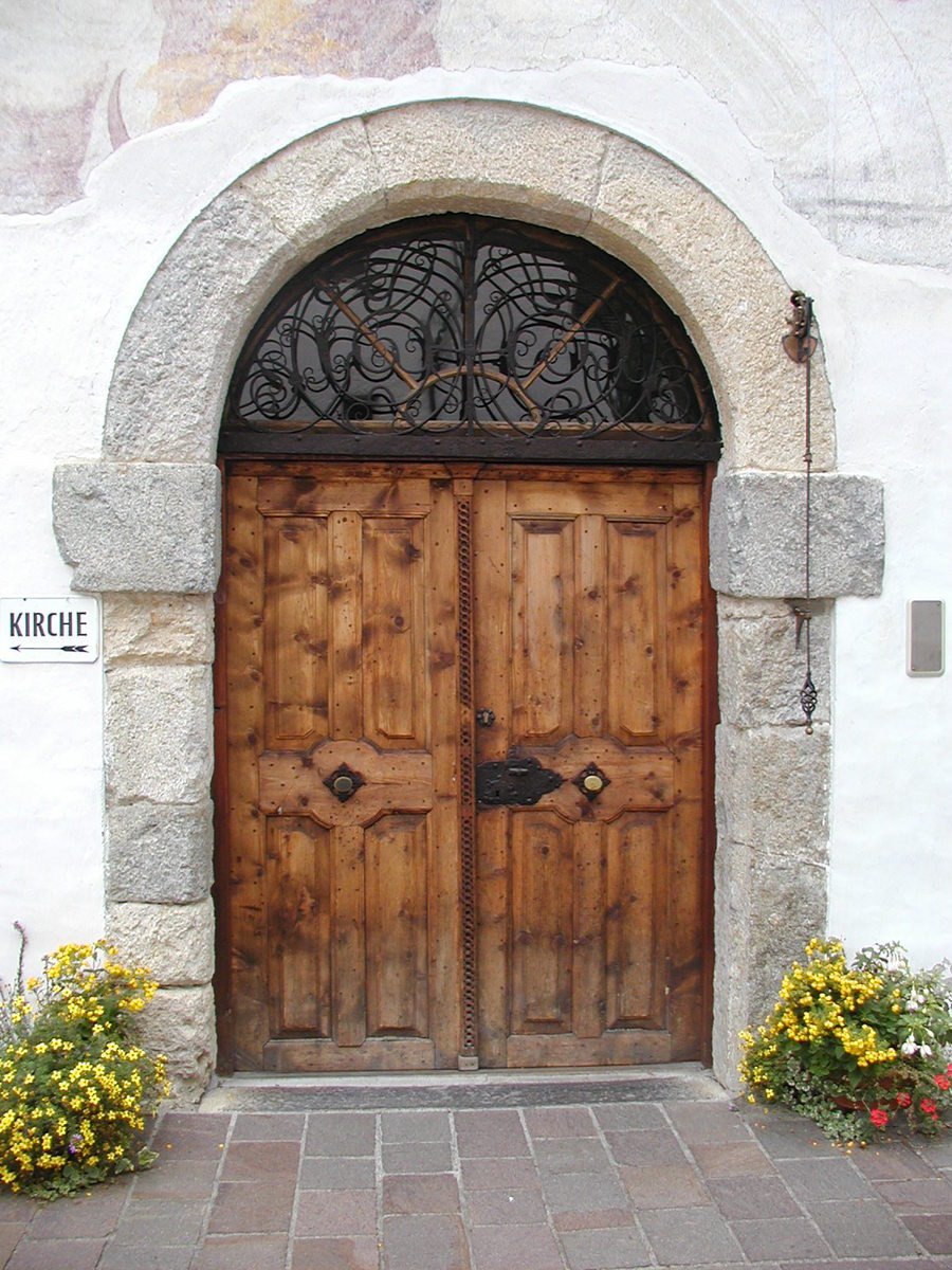 a large door with fancy iron work on it