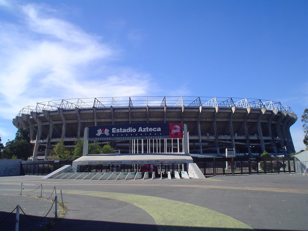 the front of a stadium stadium with a clock on the side