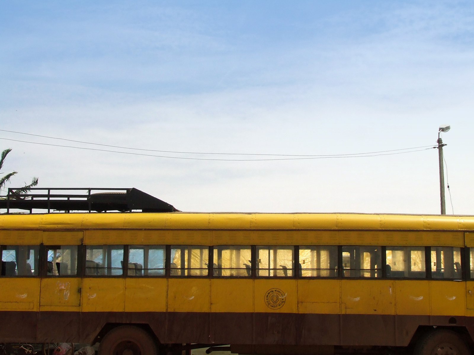 a bus traveling down the road near a building