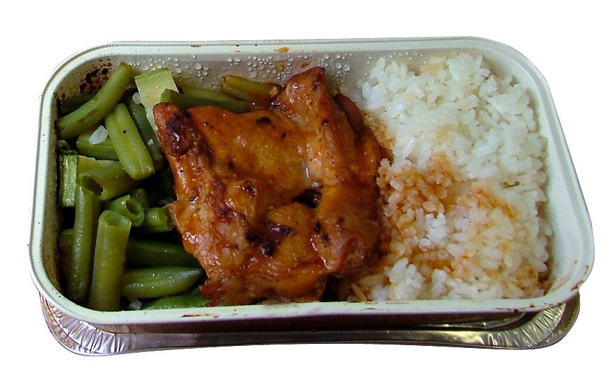 a container of rice and meat on a white surface