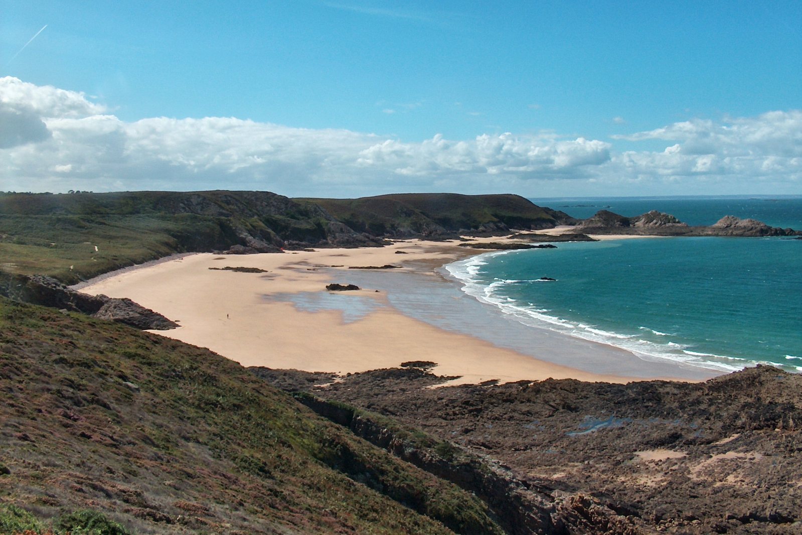 the beach in the distance has blue water