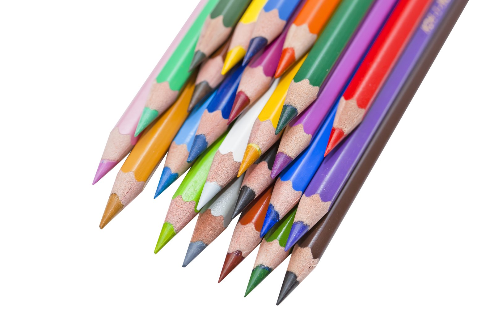 closeup view of colored pencils against a white background