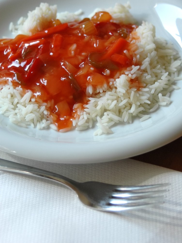 a white plate of food on top of a table