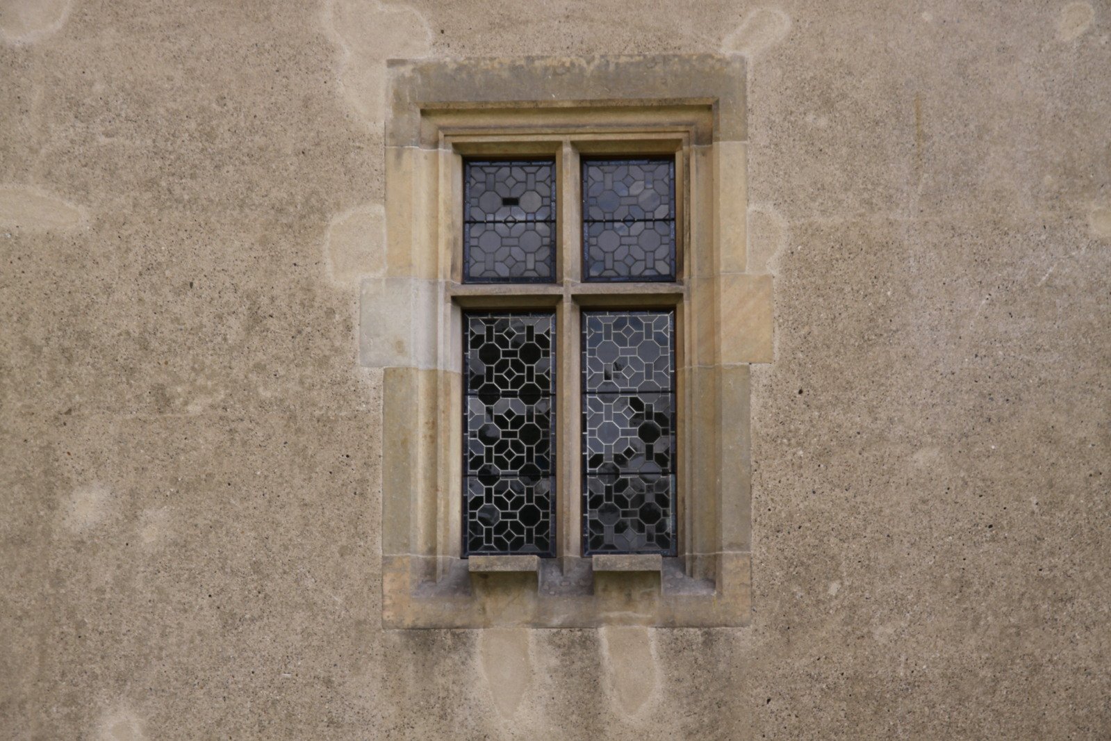 a window with bars are shown on the outside of the wall