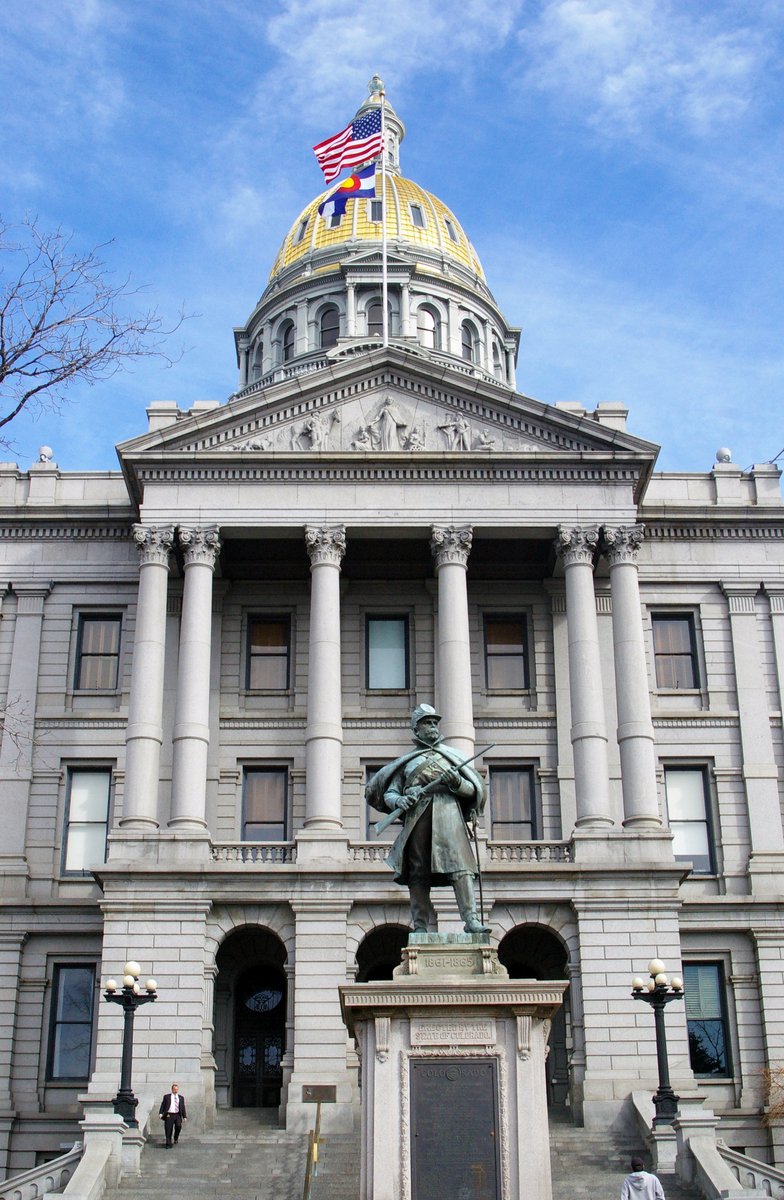 a statue of the man outside the capitol building