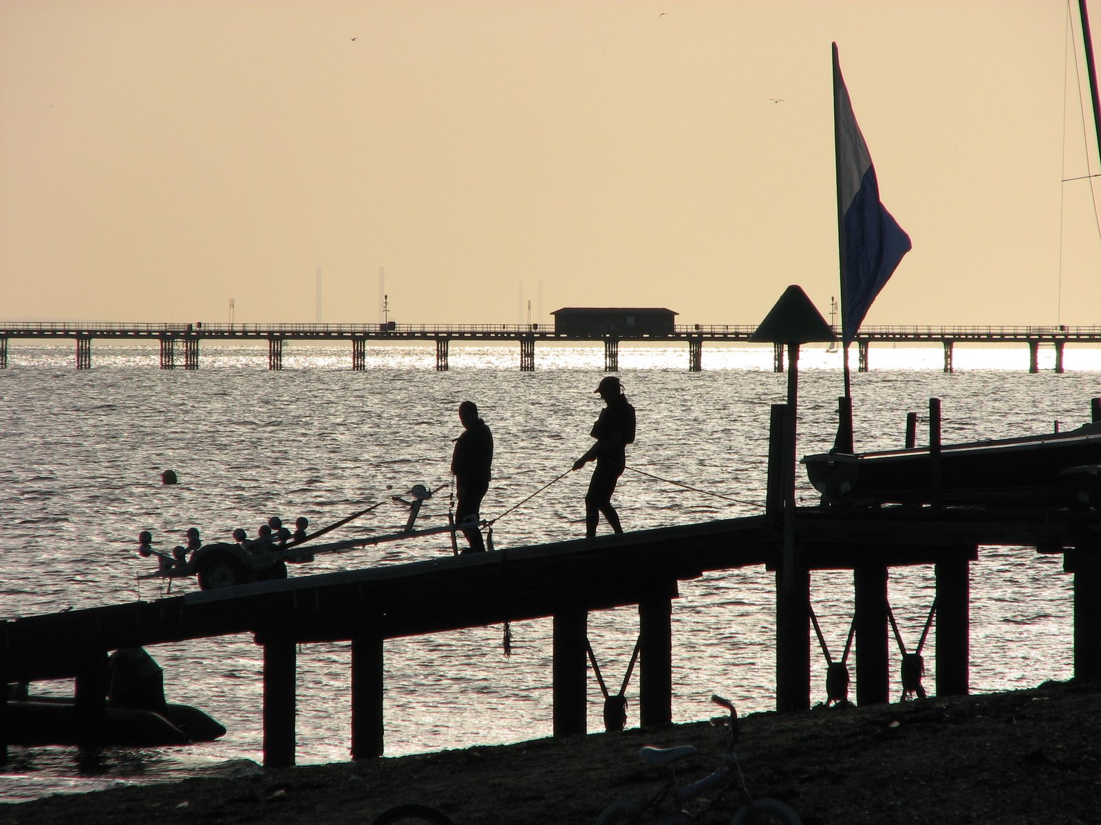 some people at the pier on a sunny day