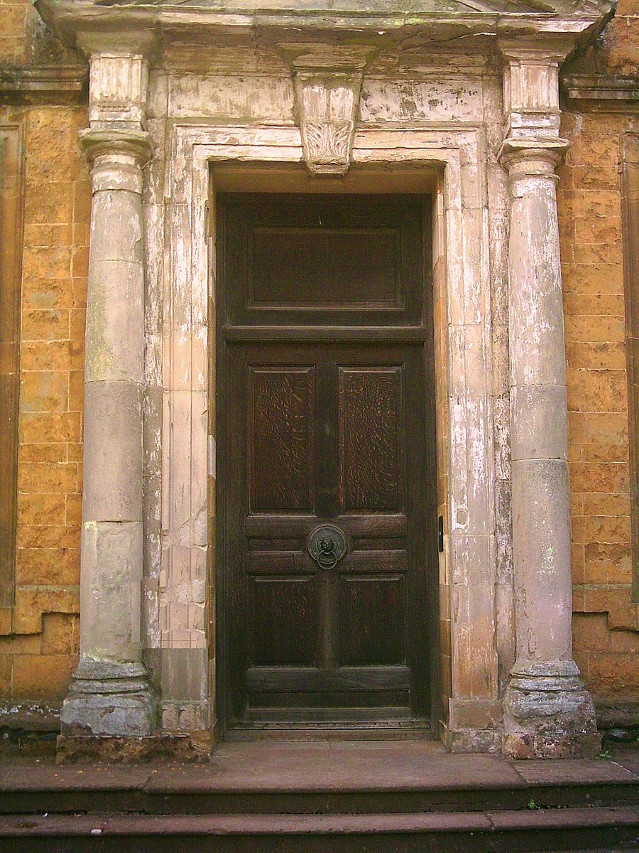 a doorway with a doorway way and stairs next to it