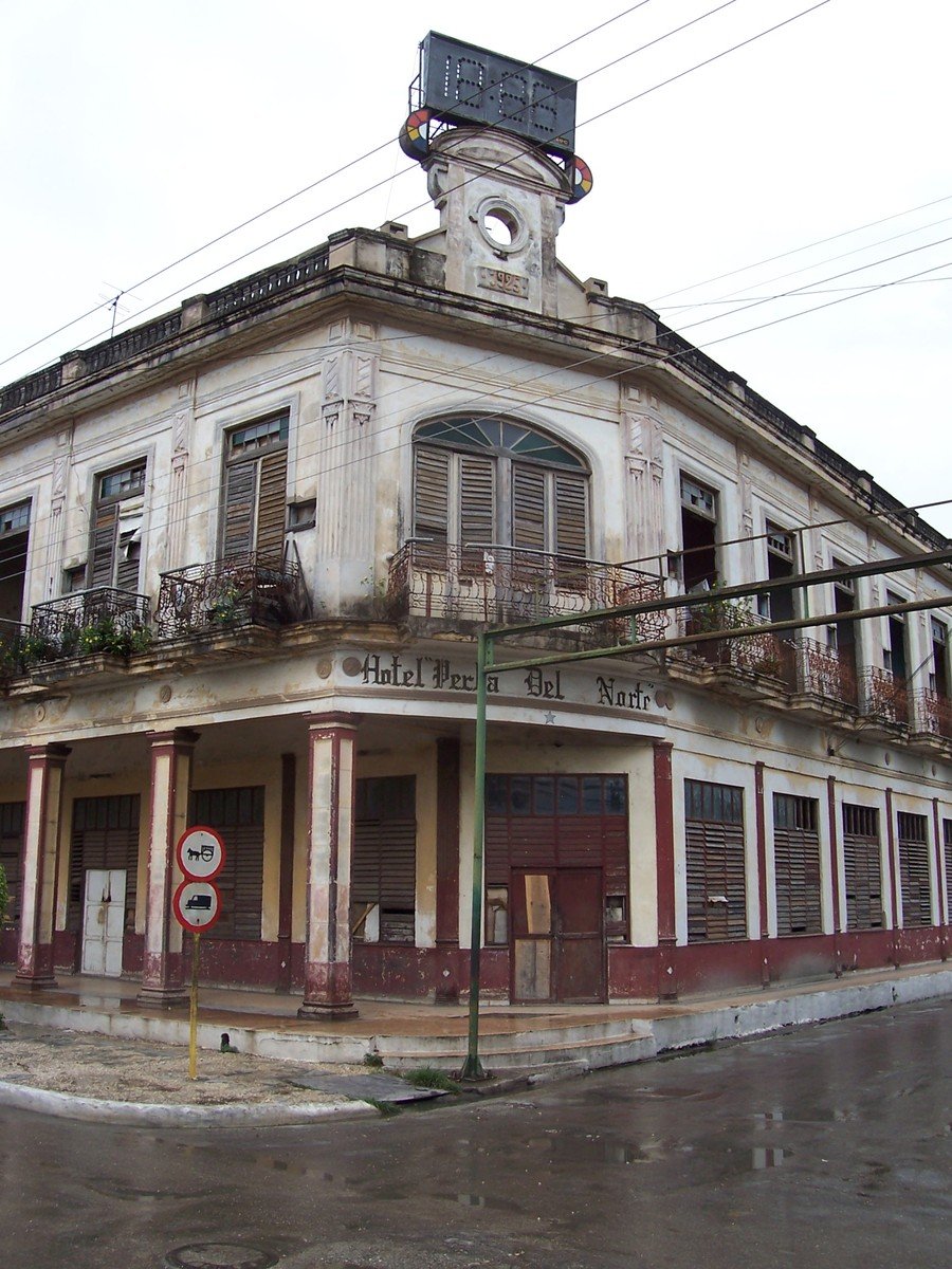 a very big old building with a clock tower on top