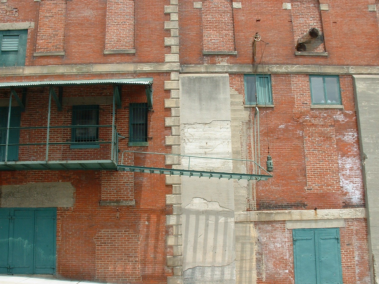 an old brick building that is missing many windows