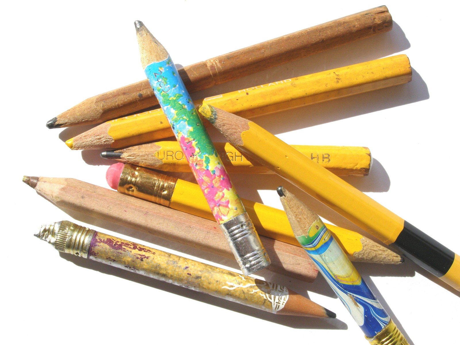 several pencils, with the other four lined up