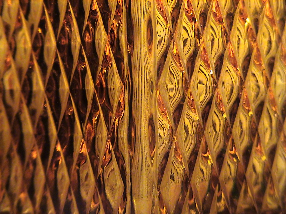 a closeup view of a window with wood background