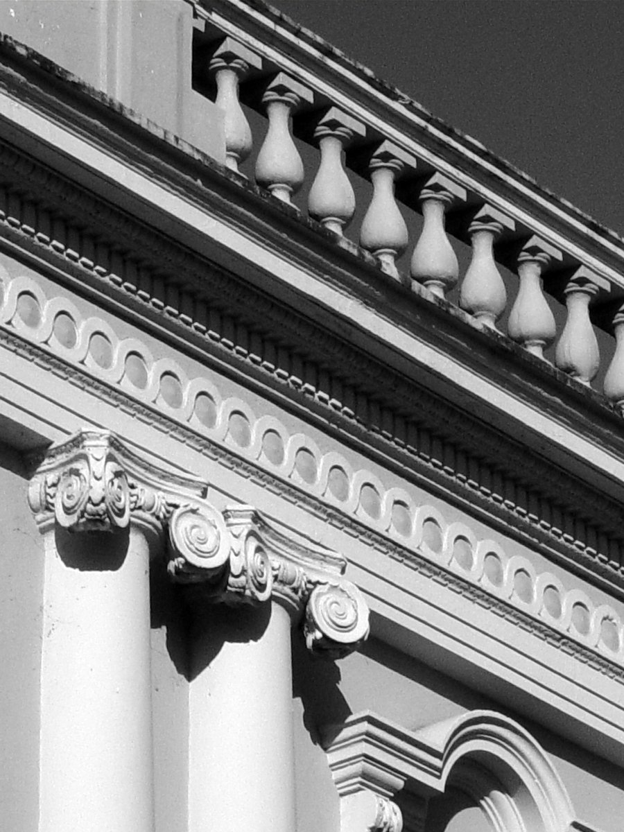 a close up view of pillars on an old building