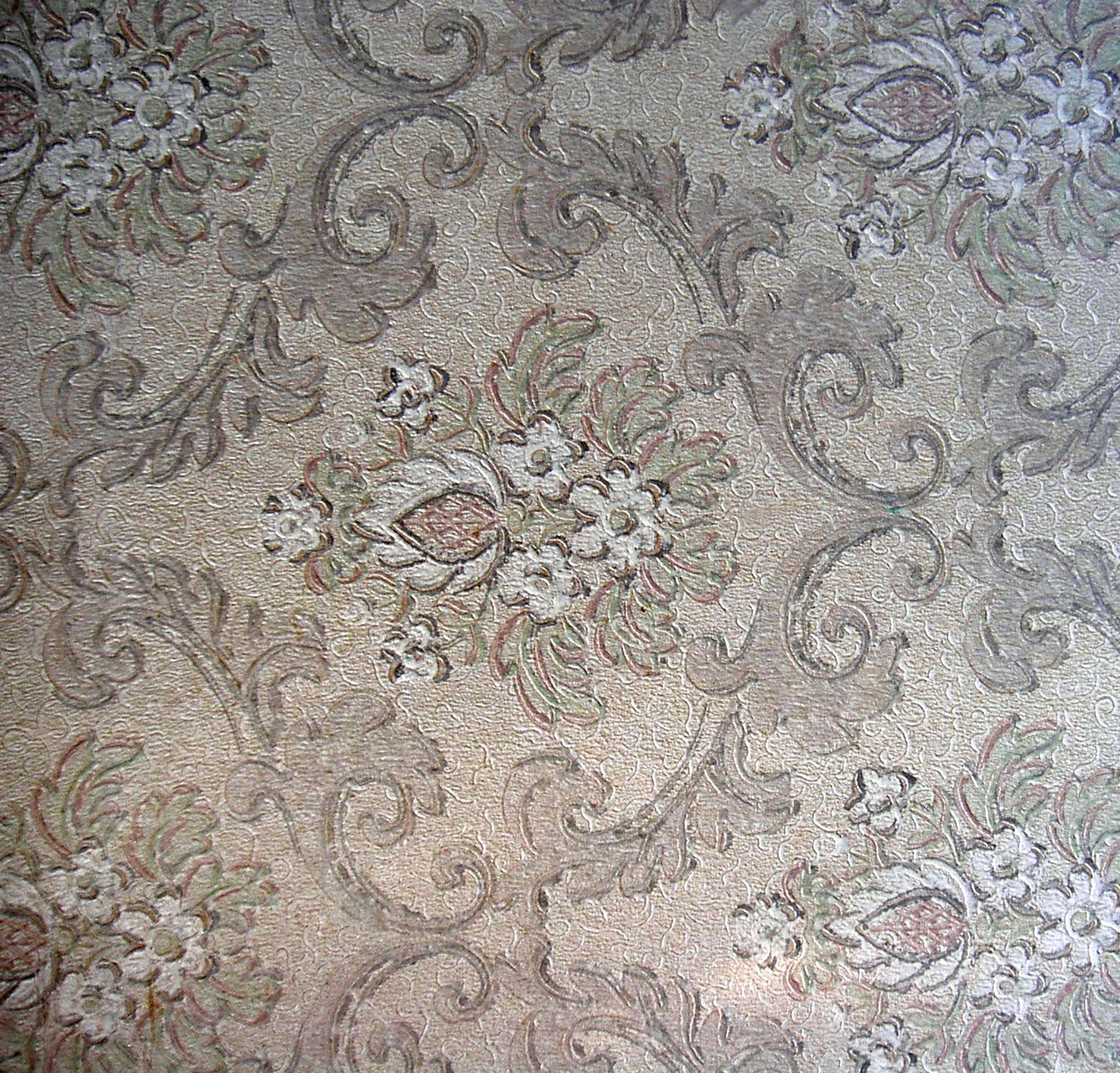 an old, wrinkled fabric with flower pattern in white and gray