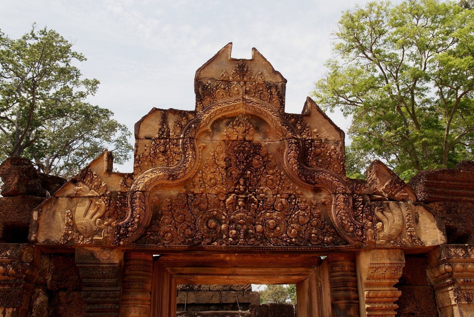 an architectural structure with an intricate carving in front