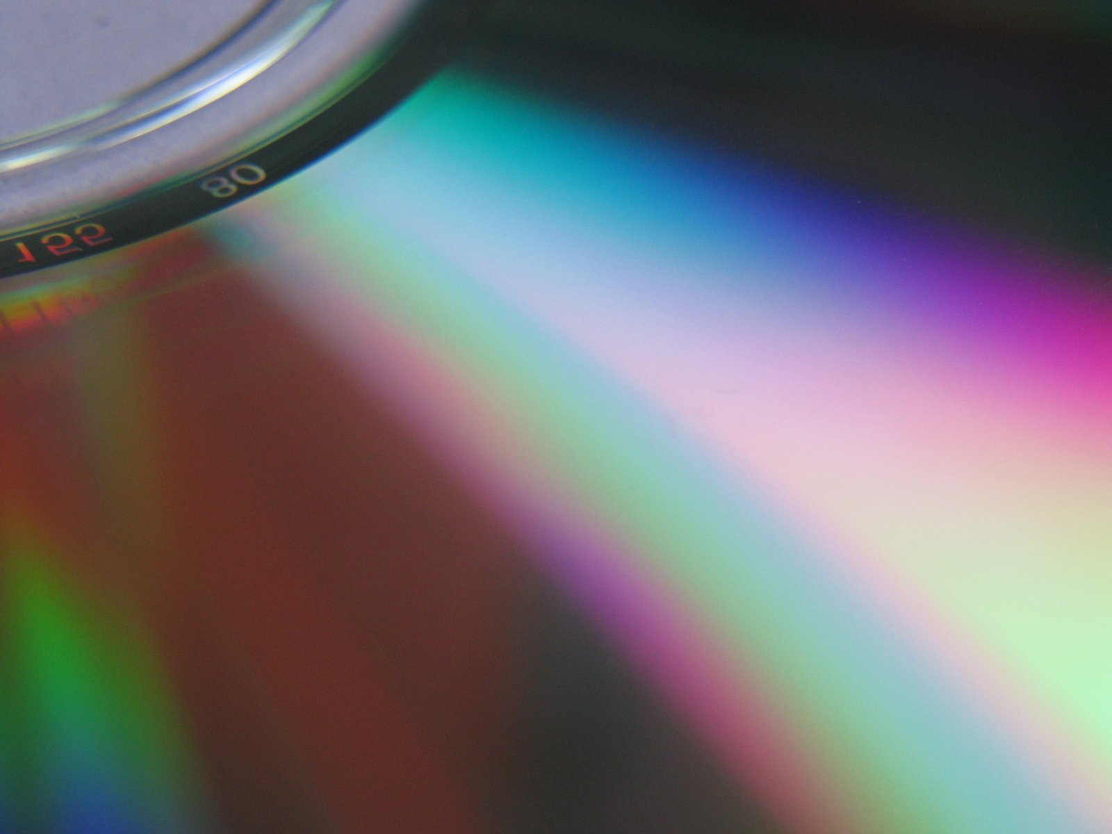 a blurry po of a cd with multi colored circles