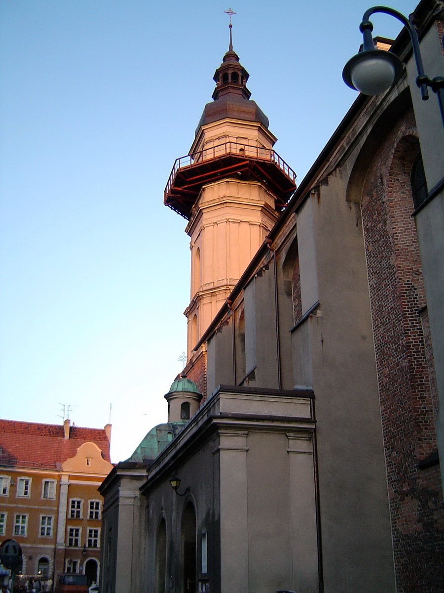 an old brick building with a large spire sticking out of it's top