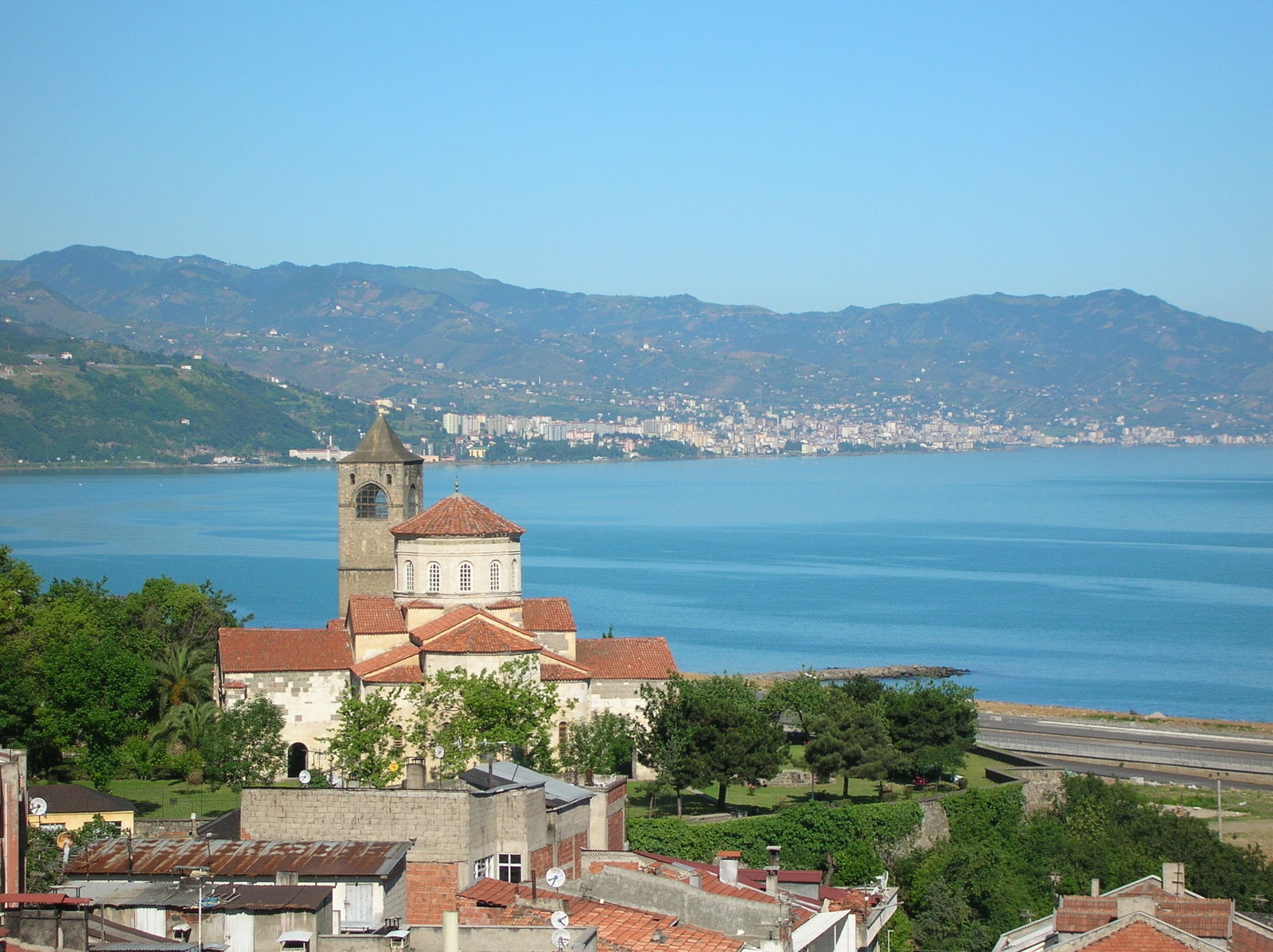 looking across a city toward a large body of water