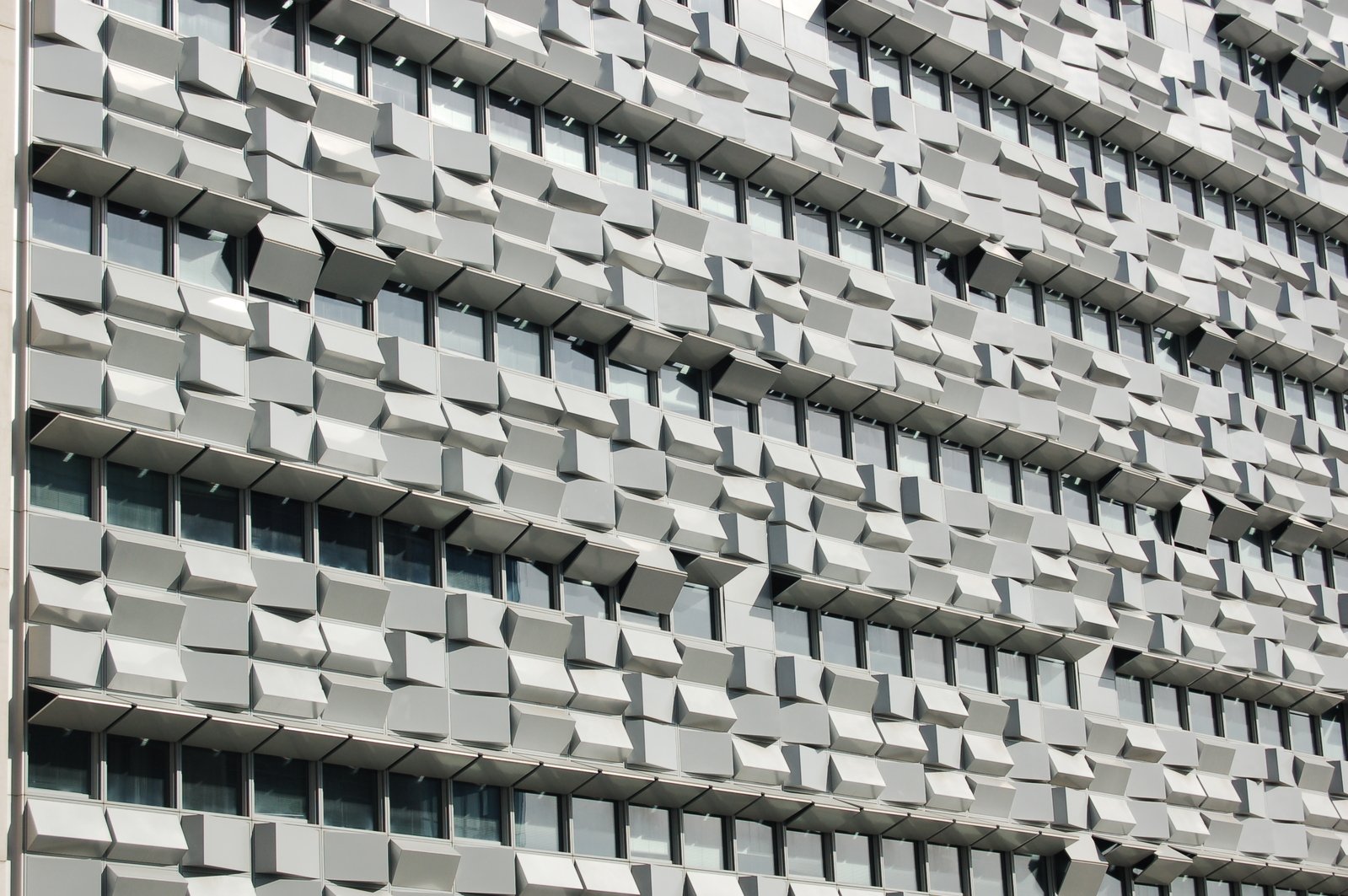 a gray building that is covering the entire front