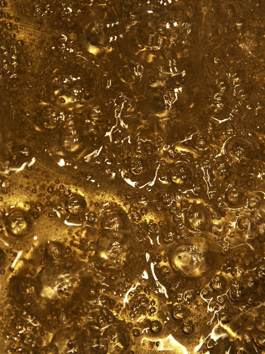 the water is golden and golden with little bubbles