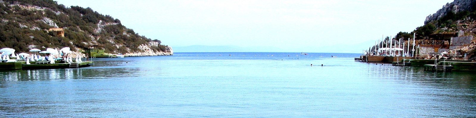 a long river is lined with people on boats