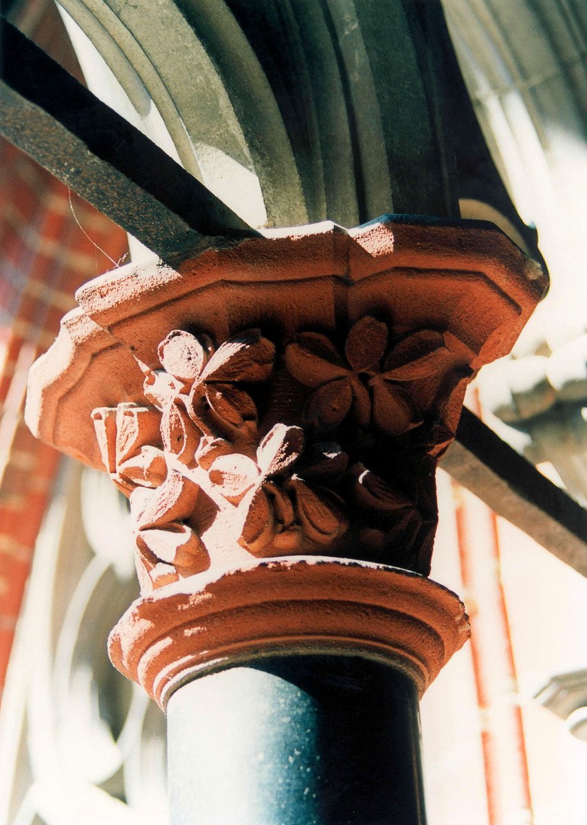 close up of the flowered motif on the side of a pillar