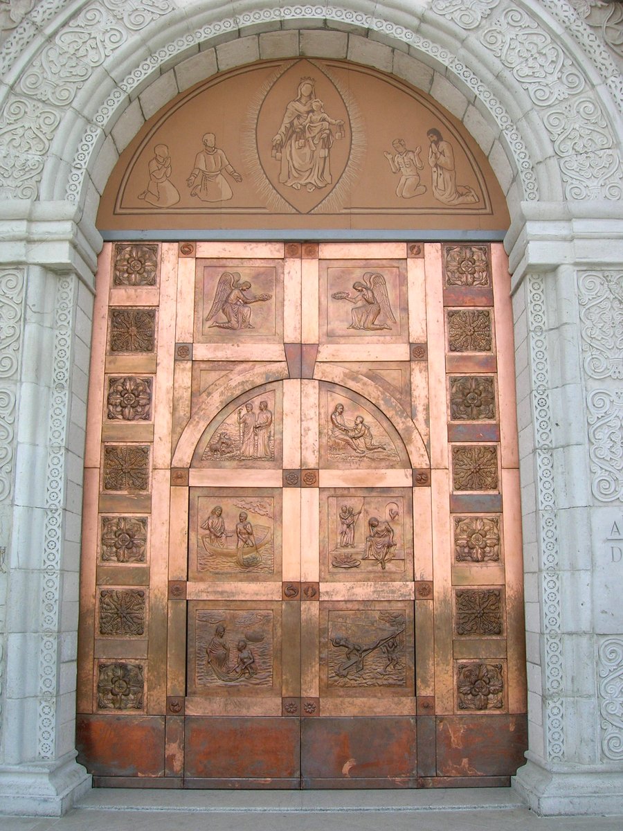 an ornate wooden doorway with carvings on it