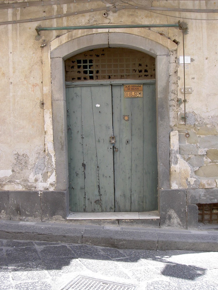 a building with a door with a sign in the doorway