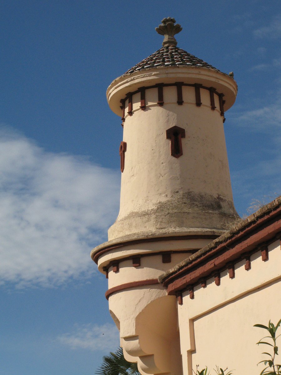 a tall tower with a clock mounted on it's side