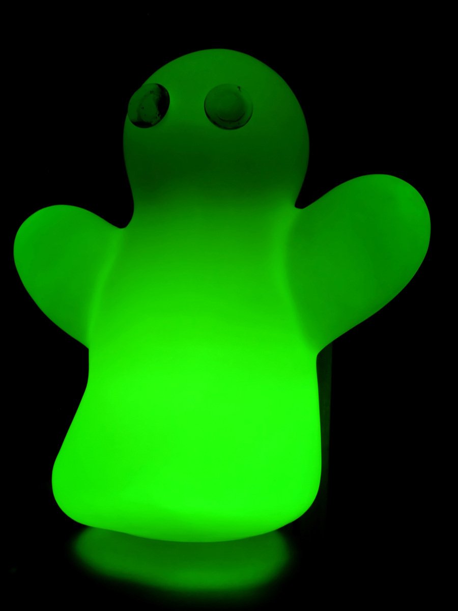 a glow toy sitting up in the dark
