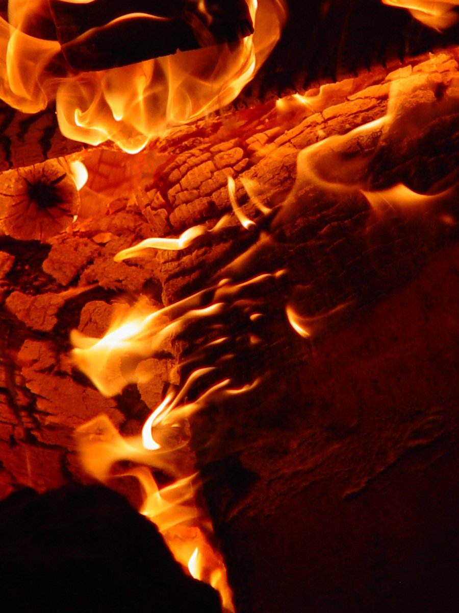 the flames of the stove are lit from up close