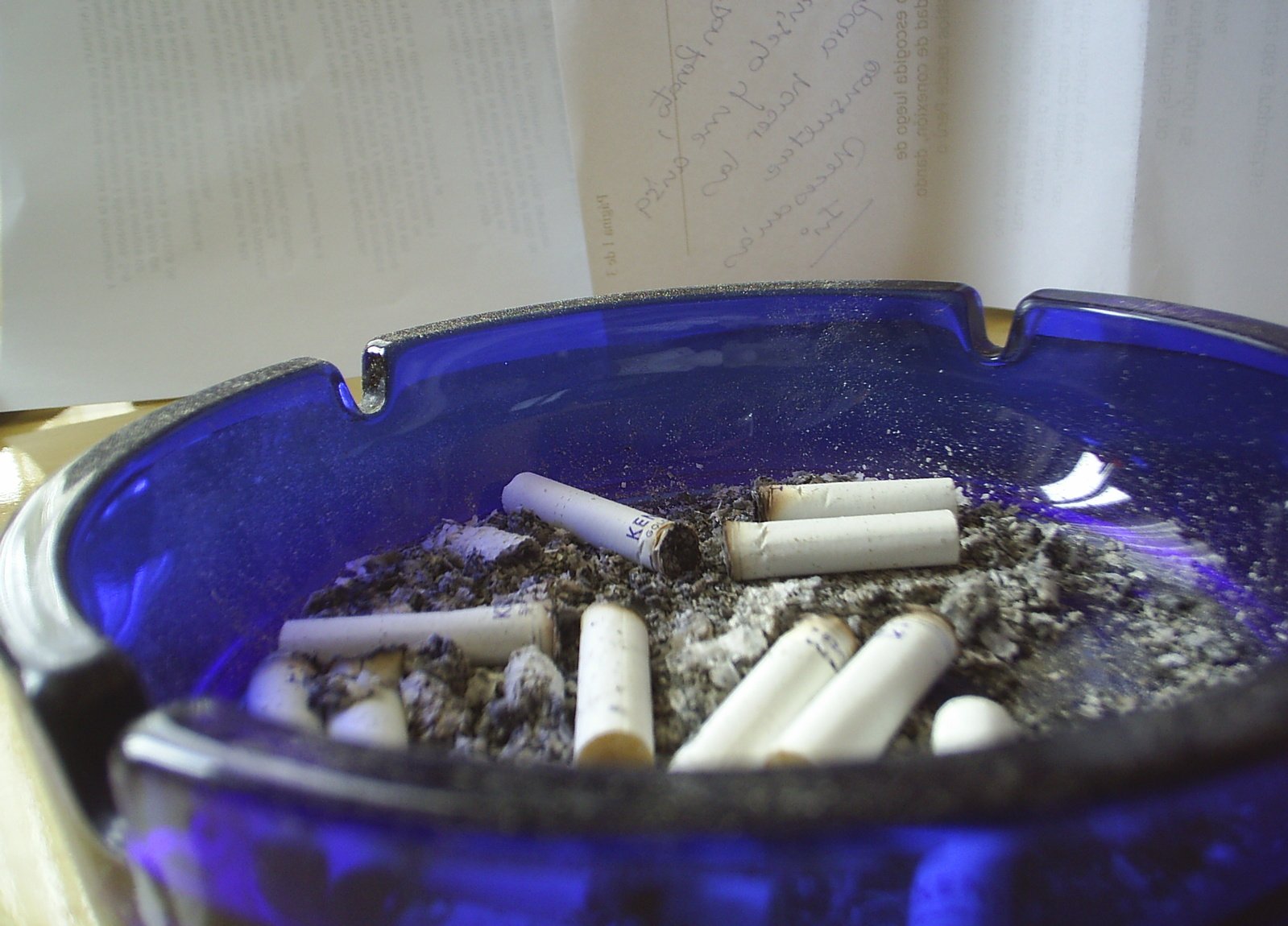 a blue container with a lot of cigarettes in it