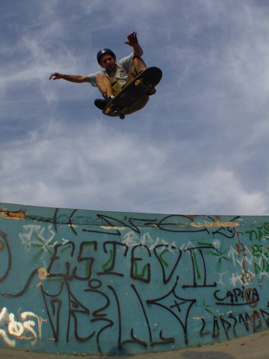 a skateboarder in mid air after doing a trick