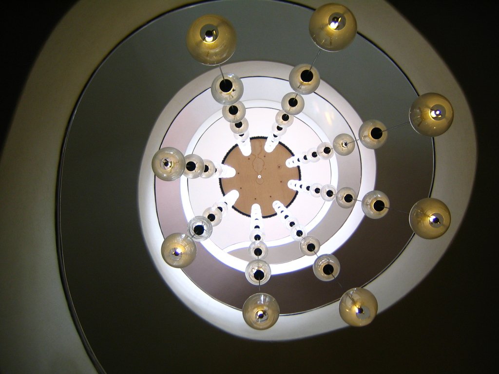 a modern ceiling that has many lights attached to it