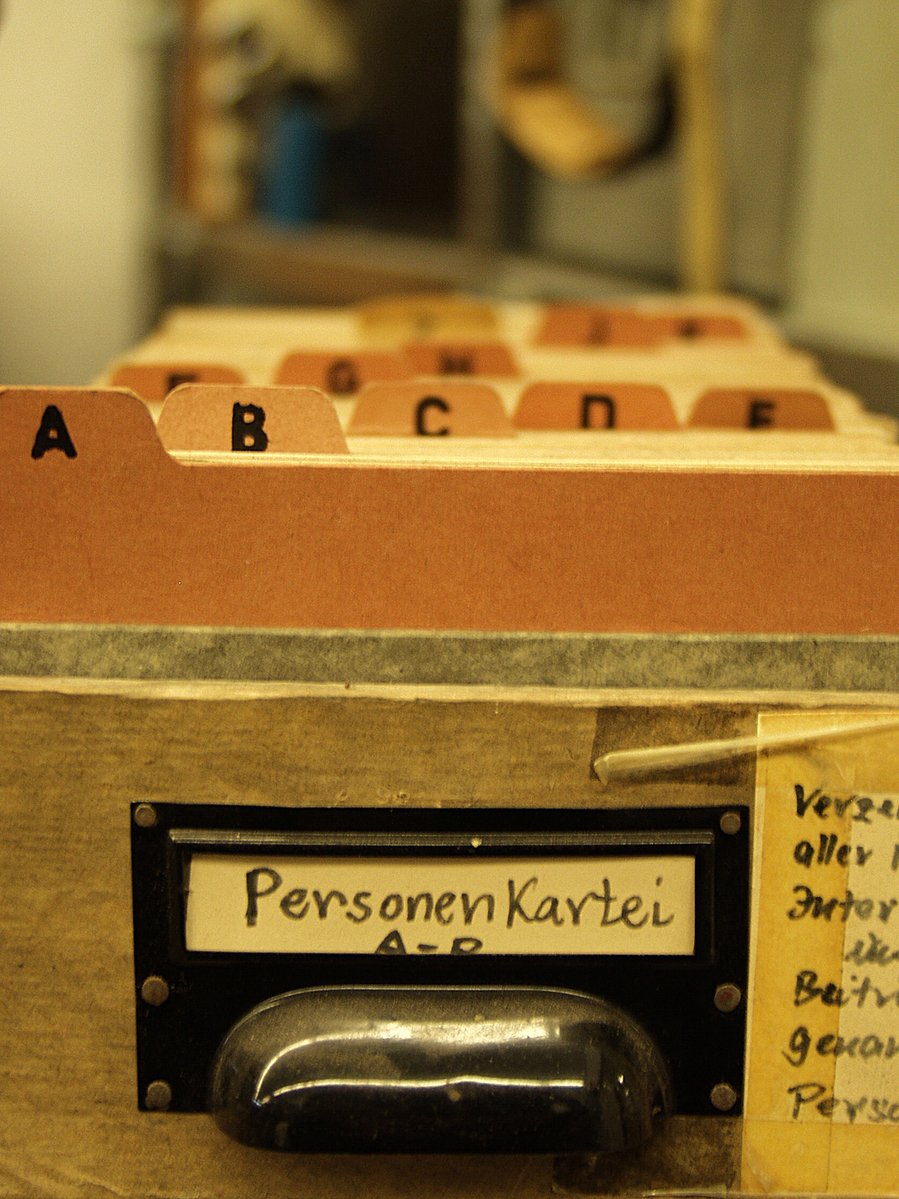 a wooden typewriter box with several words written on it