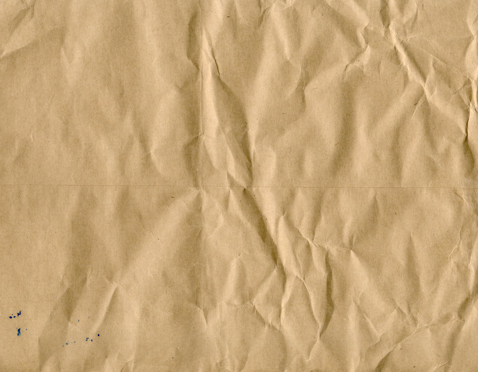 this crumpled brown paper contains some blue specks