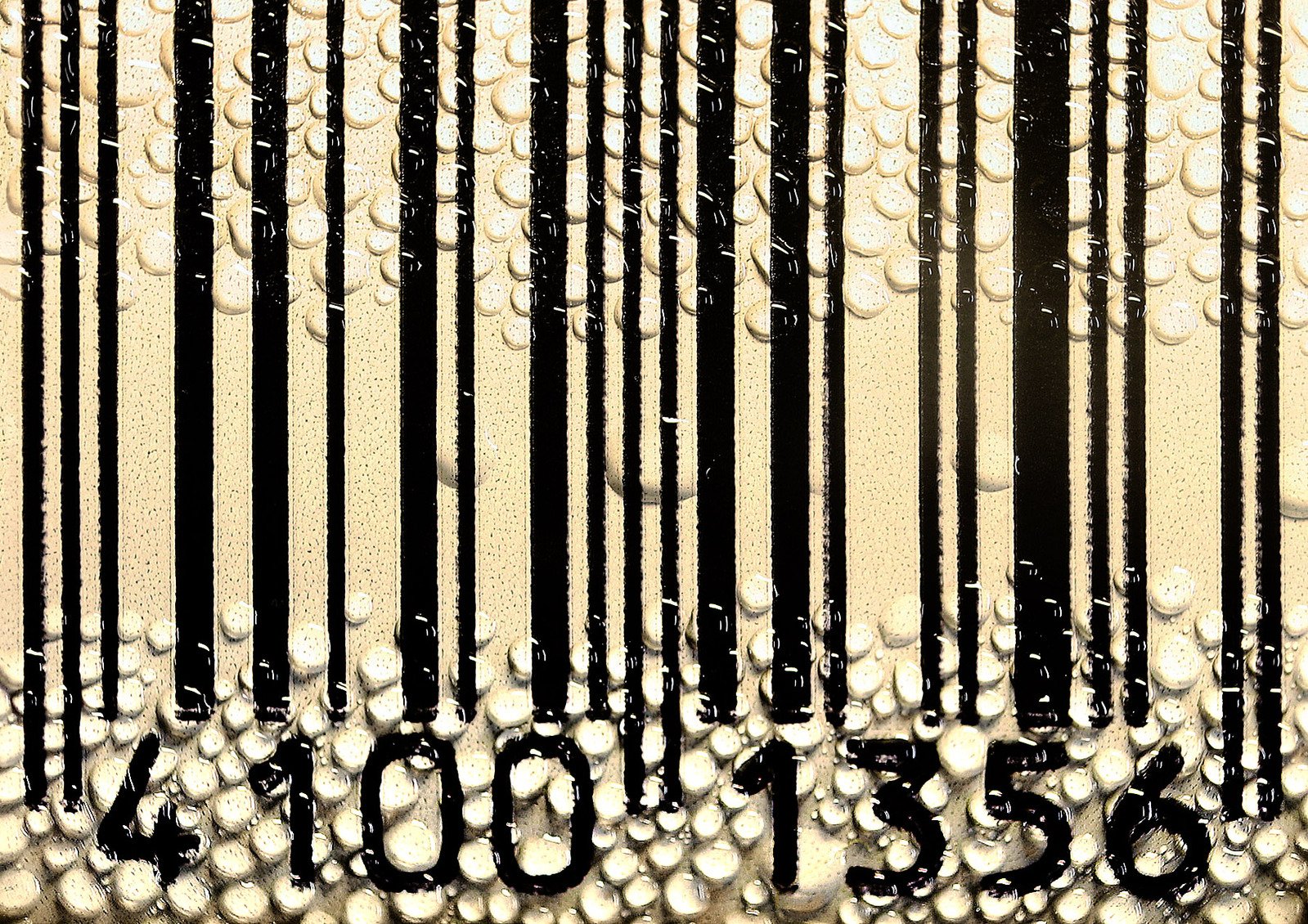 a barcode covered in water drops on the ground