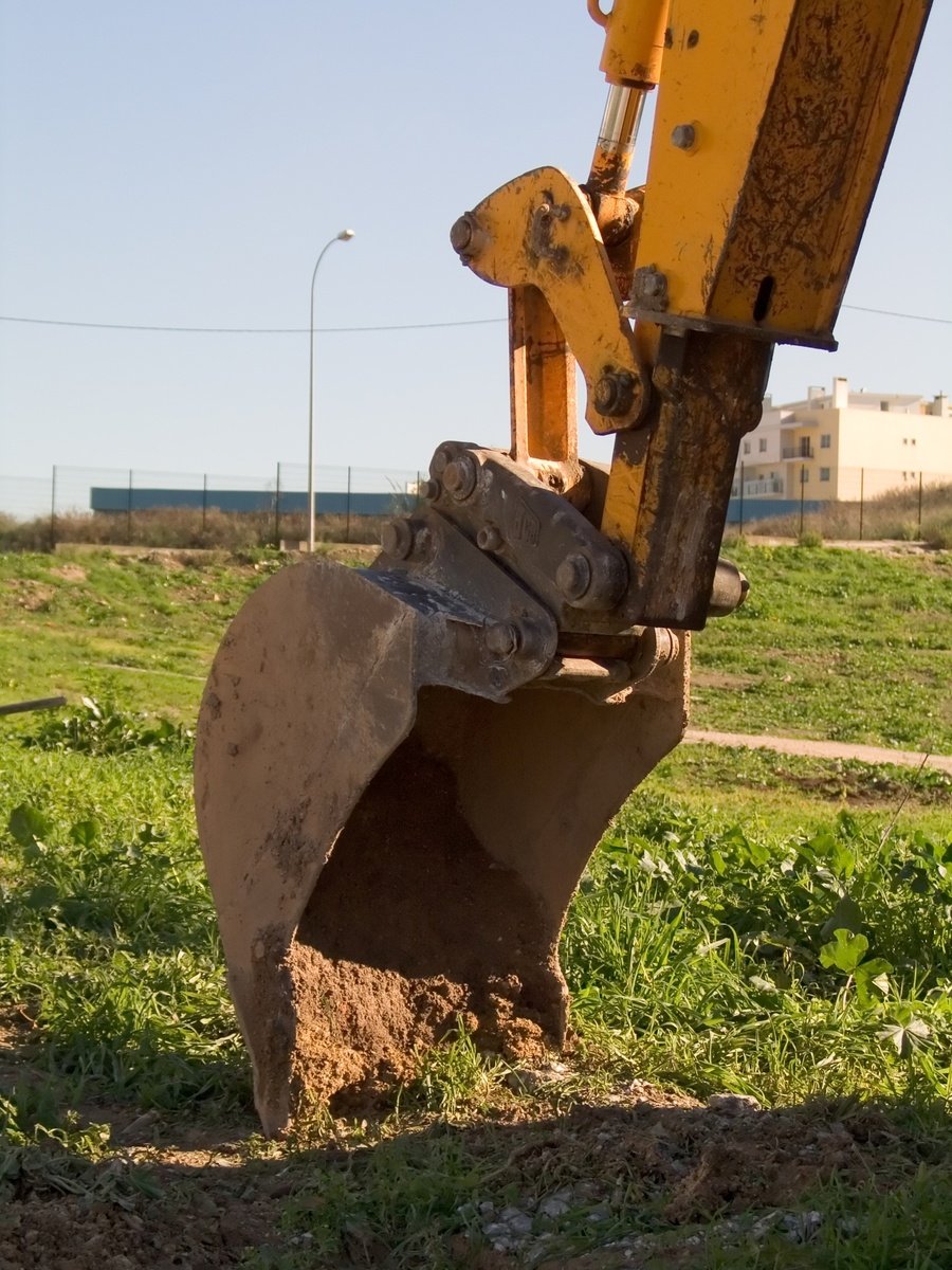 the back end of a machine is shown on the ground