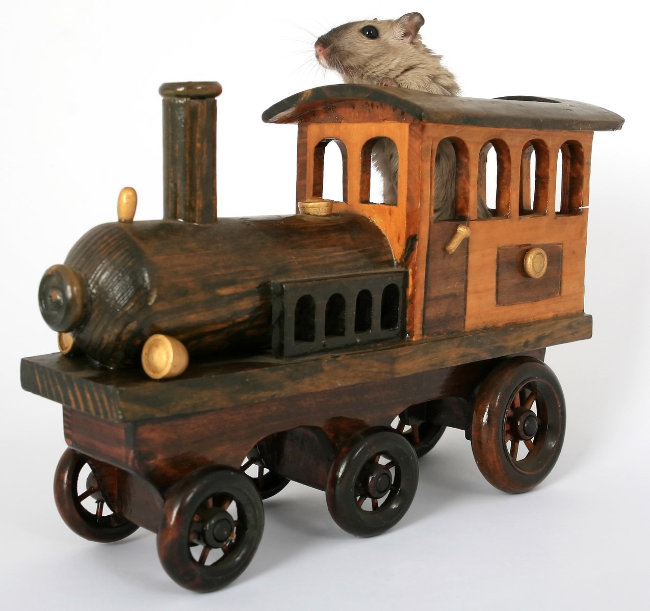 a wooden toy train with a mouse sitting on top