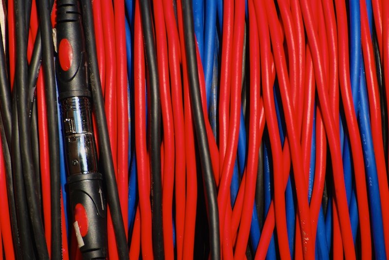 several cables of different sizes, and colors, laid neatly together