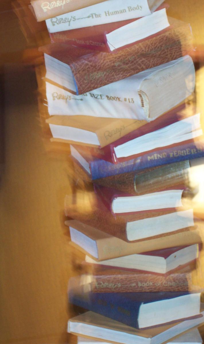 a stack of books in a bag with many pages piled up