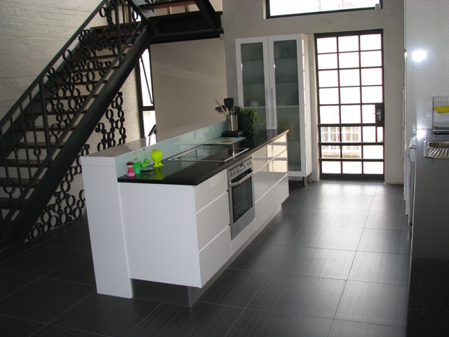 kitchen with tile floor and black counter top