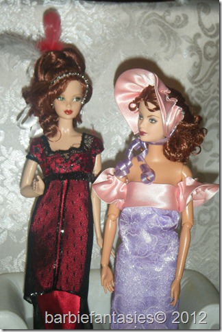 two dolls are in dressy outfits and with hair down