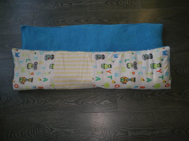 a pair of baby changing pads with blue backing