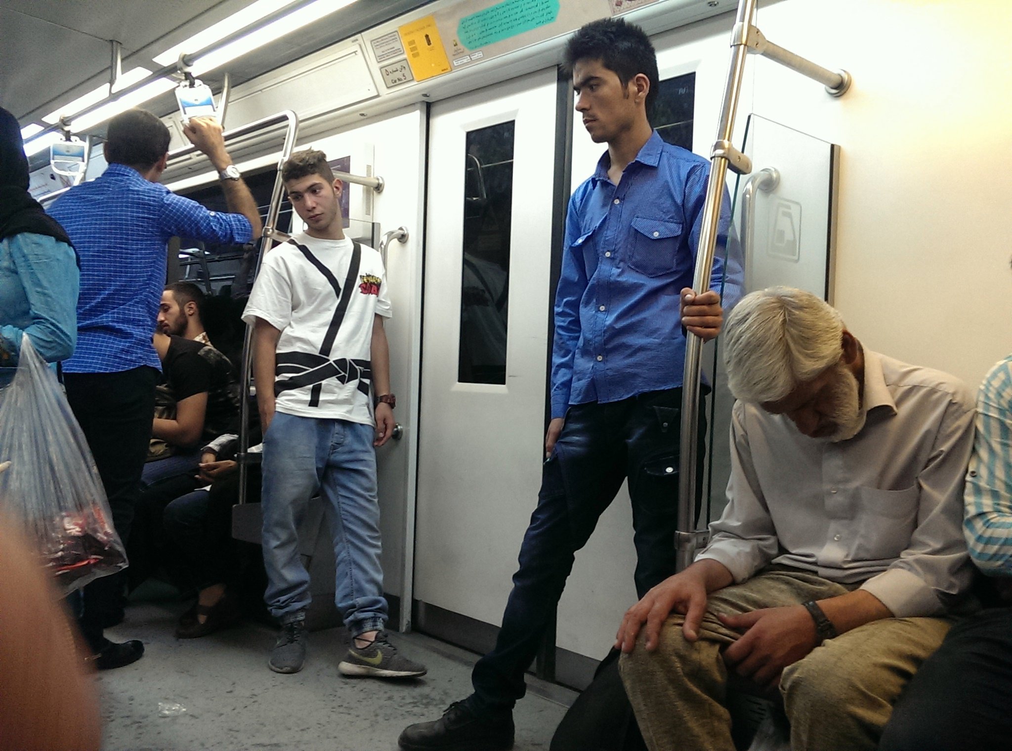 a group of people that are on a subway