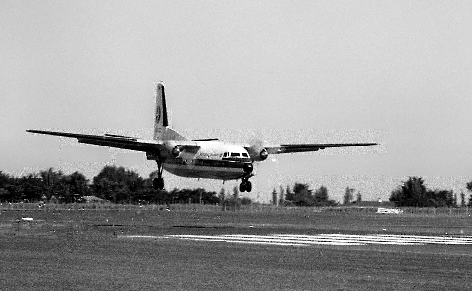 an airplane landing on the runway at an airport