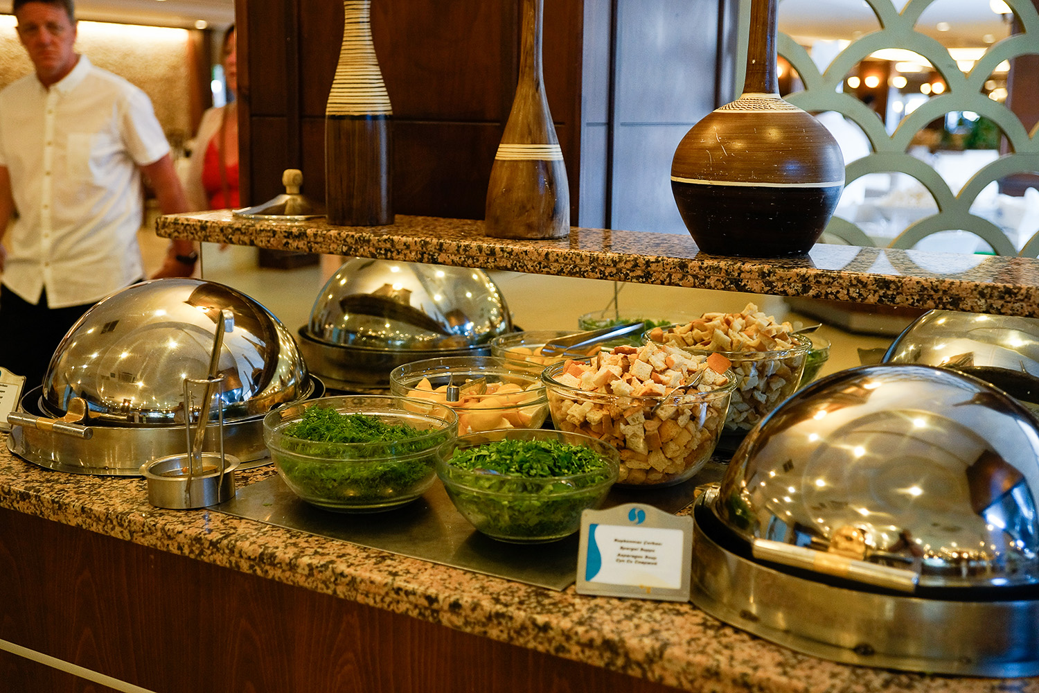 buffet set up in el kitchen area with chefs nearby