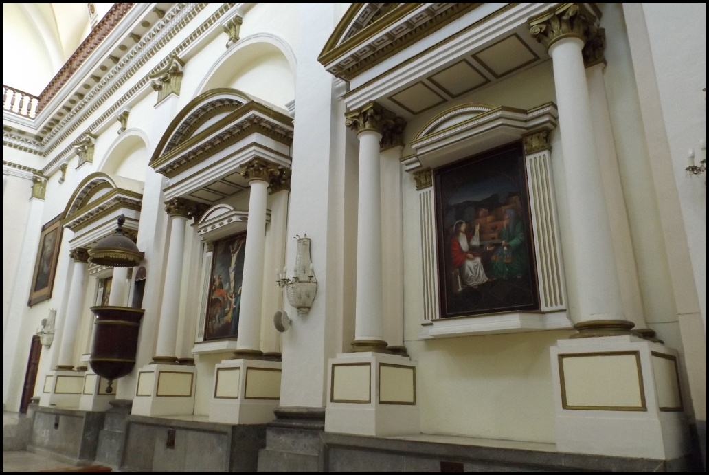 two pictures of jesus on the wall of a building