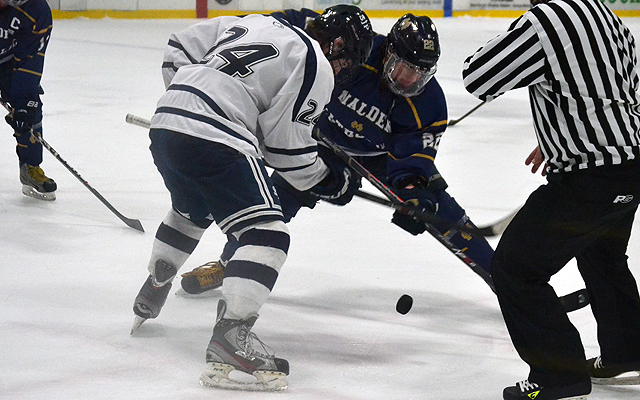 some people playing a game of ice hockey