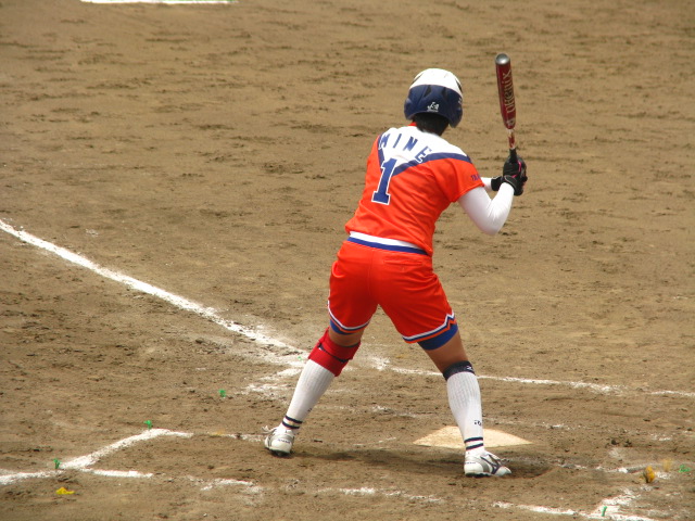 a baseball player taking a swing at a ball
