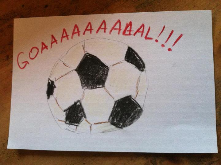 a drawing with a black and white soccer ball on it